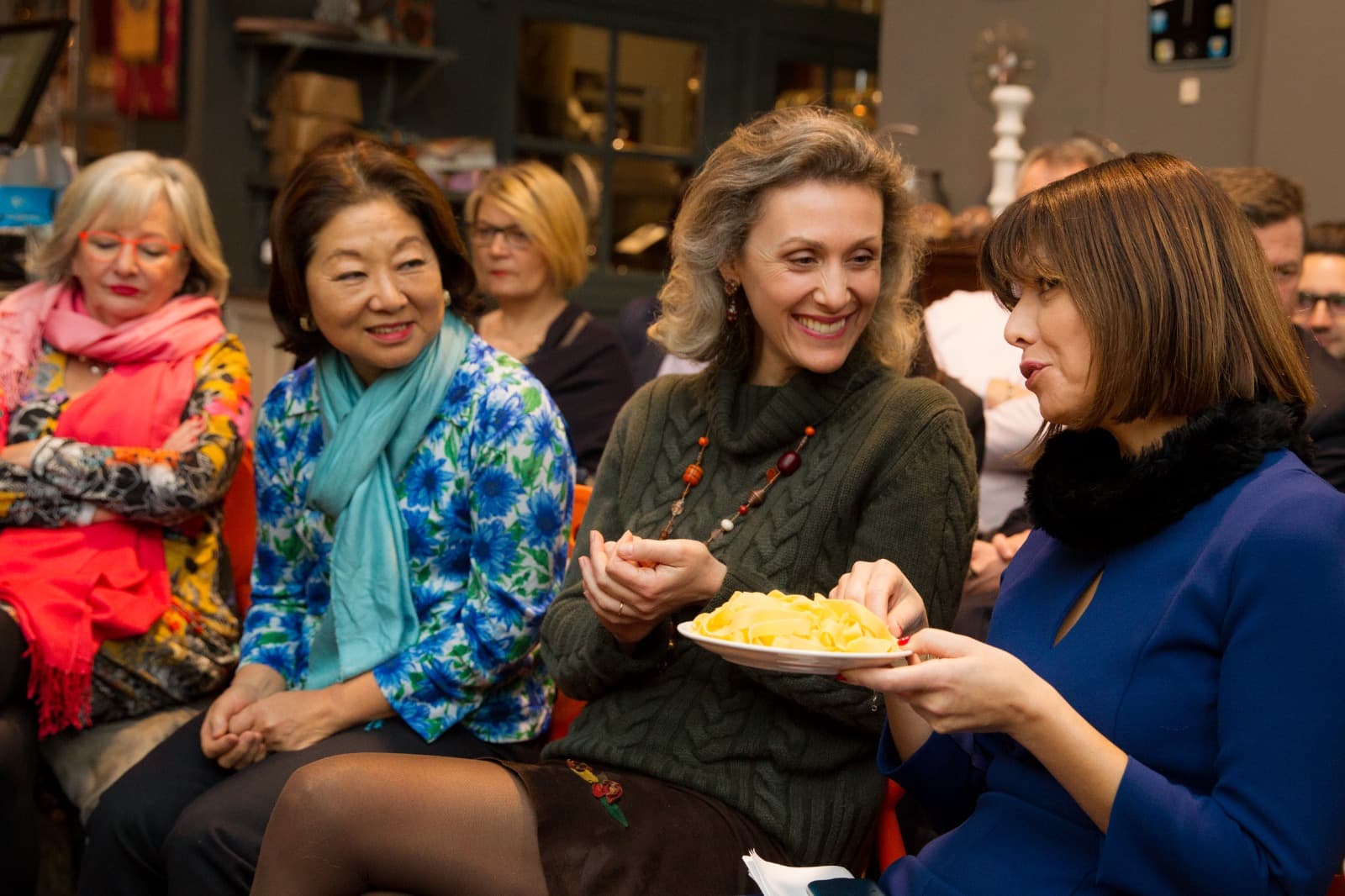 Woman sampling Fresh Pasta on a Maestri Event